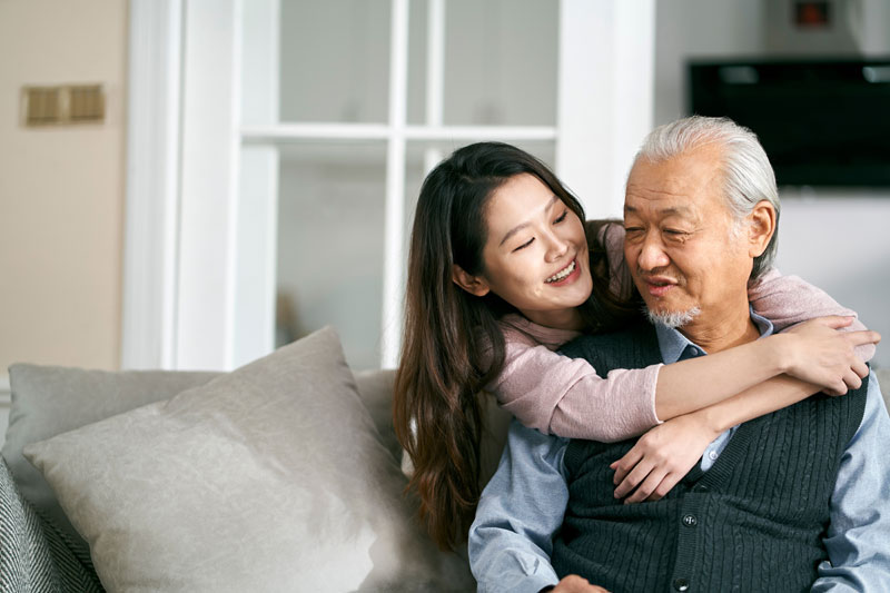 image of a daughter caring for her father